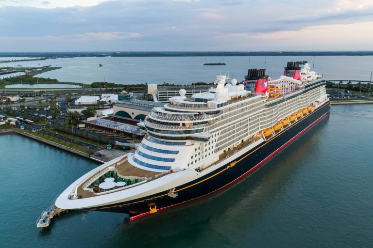 How far is Port Canaveral from Orlando, and can I go to Disney and Universal from a cruise ship?