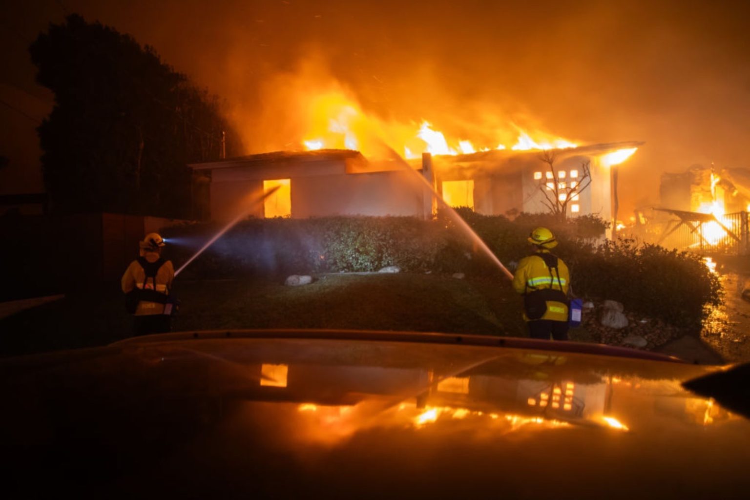 Raging wildfires force flight cancellations and closings of Los Angeles attractions