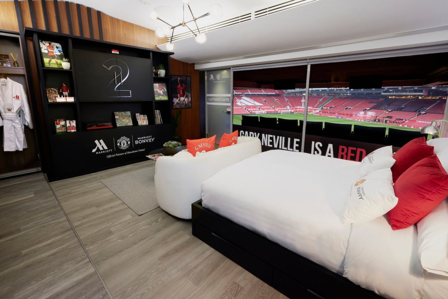 You could spend the night at Manchester United’s Old Trafford stadium — and hang with legendary player Gary Neville